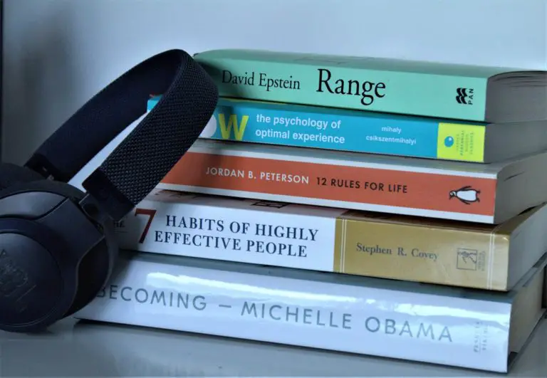 Picture of books with a headset next to them