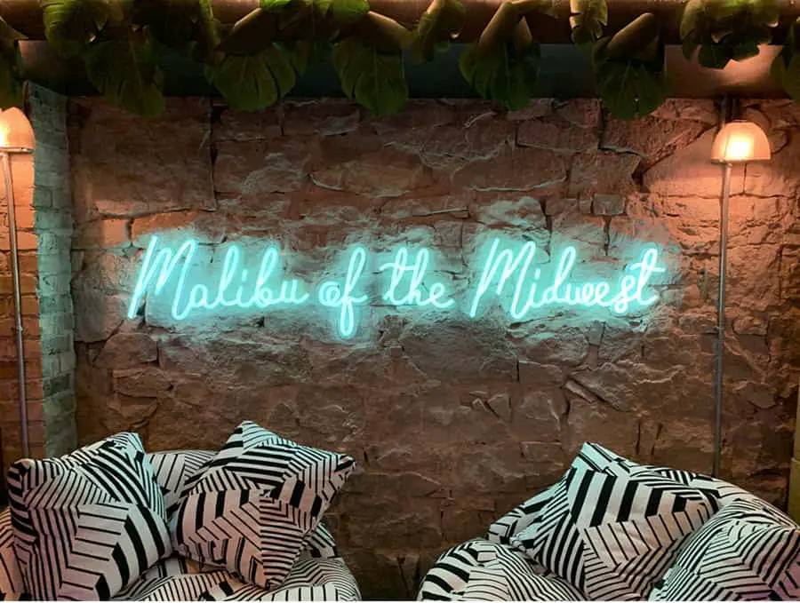 Image of Neon Sign that reads "Malibu of the Midwest"