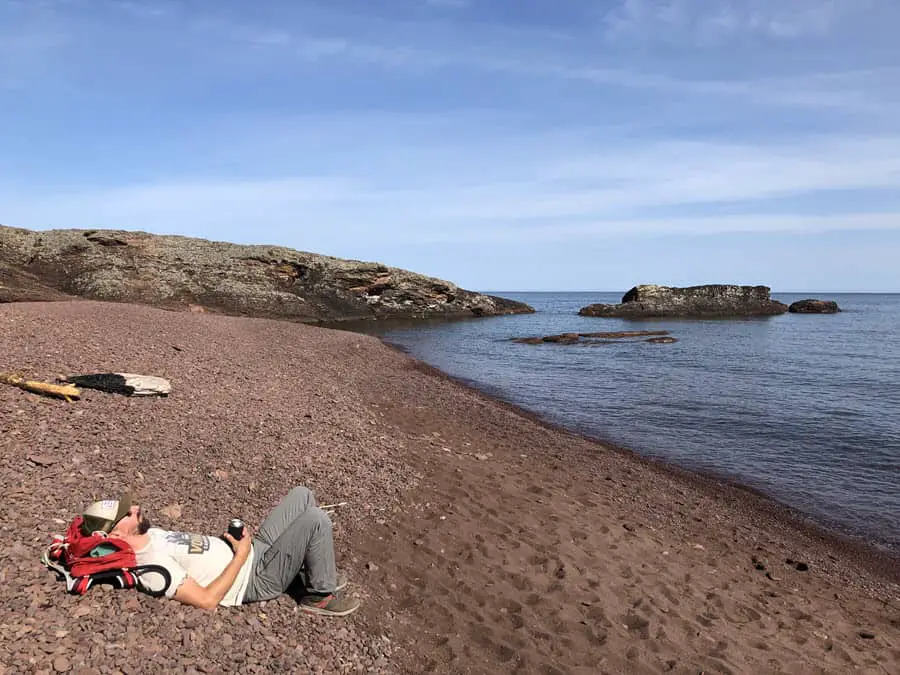 Image of author relaxing on the Horseshoe Harbor beach with no other person in sight