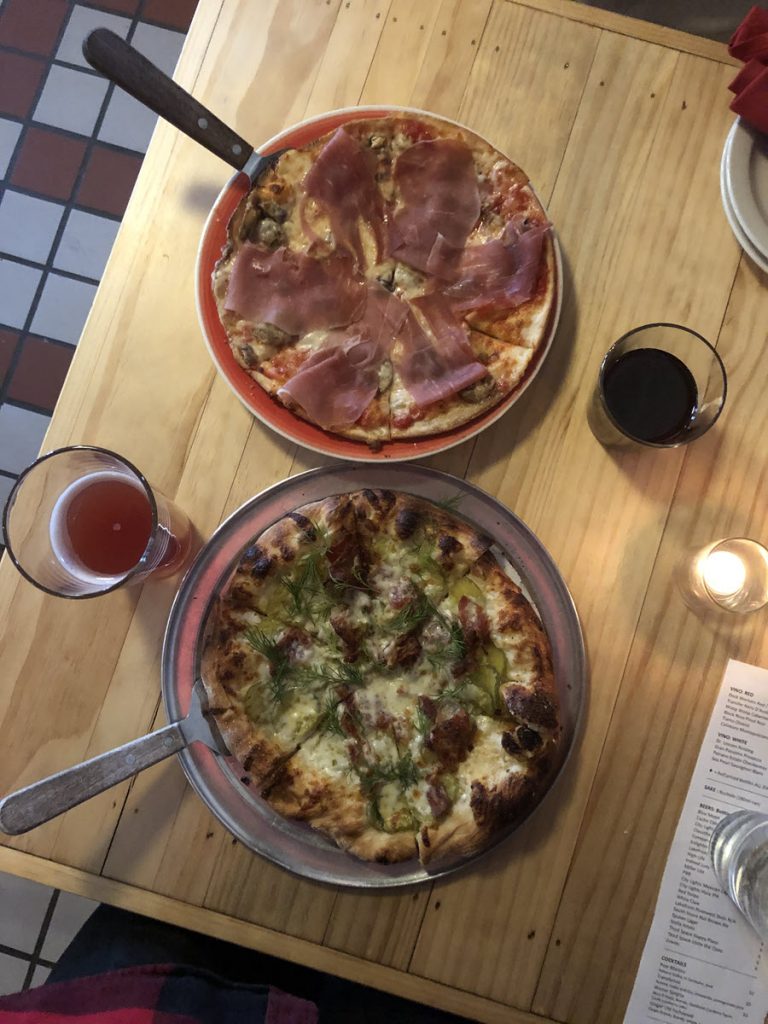 Image looking at two pizzas and drinks from Transfer Pizza in Milwaukee