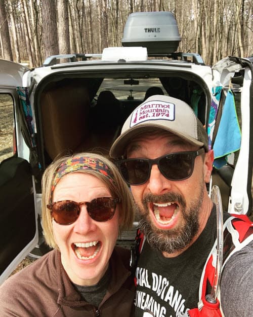 Picture of Craig and Mel in front of Albie the Campervan