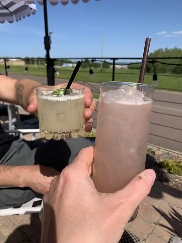 Image of two cocktail glasses "cheering"