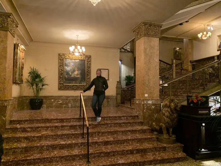 Melody standing on the stairs in the historic Pfister hotel in Milwaukee Wisconsin