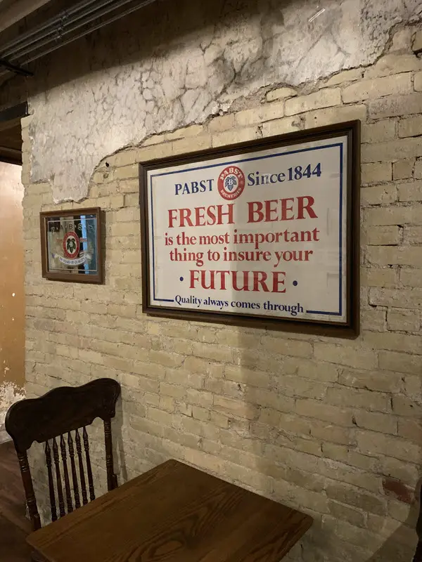 Old sign that reads "Fresh Beer is the most important thing to insure your future"