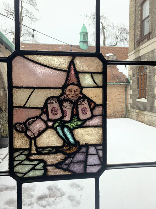 Image of stained glass picturing a gnome at Best Place Milwaukee WI