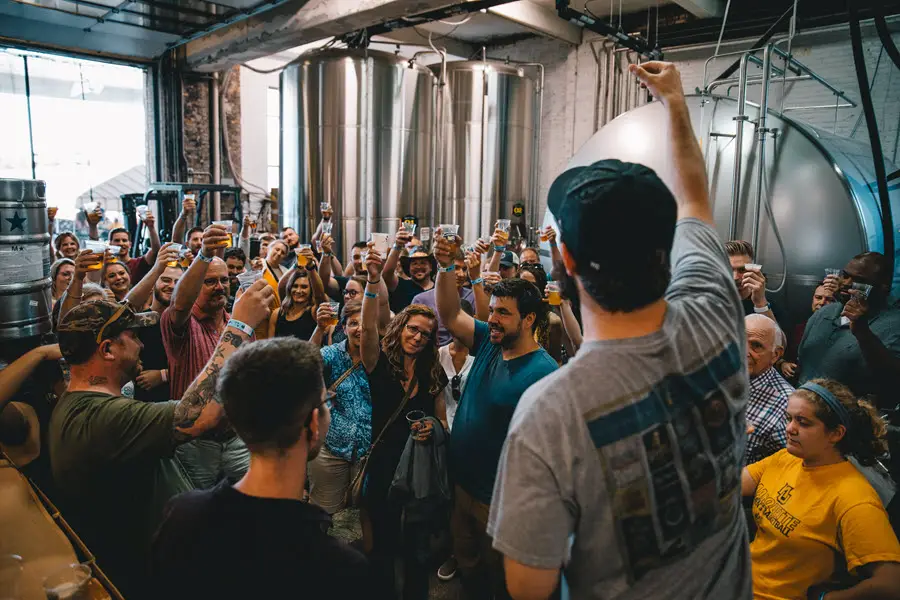 Image of a "cheers" on the Lakefront Brewery Tour in Milwaukee, WI