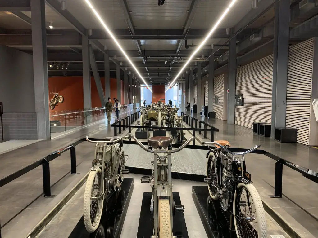 Image of inside of Harley Davidson Museum. Image is of the motorcycles from the years.