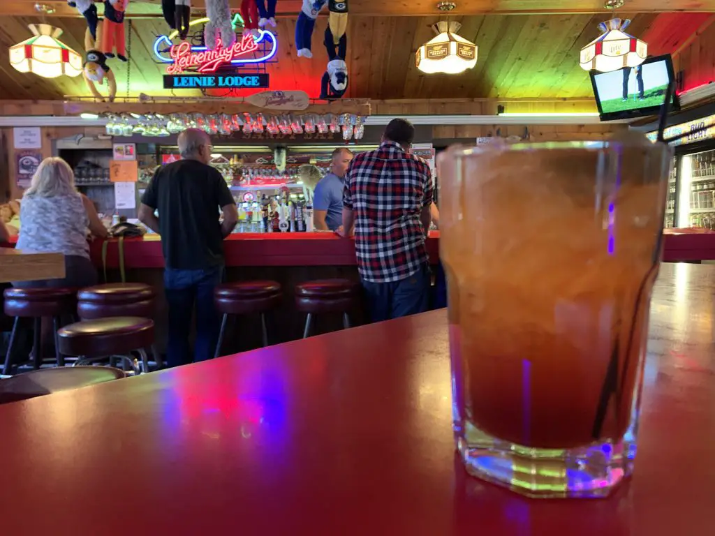 Image of Old Fashioned Drink with bar in the background at Port Sandy Bay in Two Rivers WI