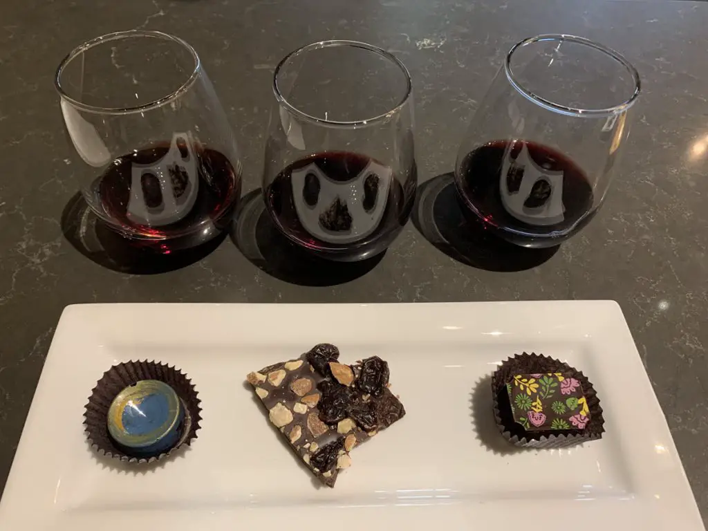 Image of three glasses of red wine paired with 3 handmade chocolates